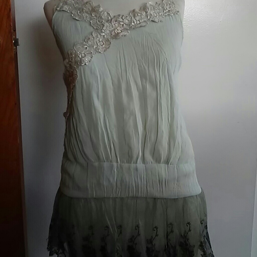 Very nice dressy tank top. Sheer multi color.